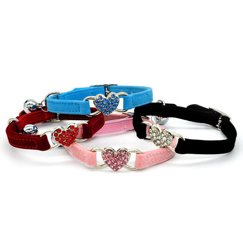 Adjustable safety cat collar with dainty heart charm, featuring a secure design and soft material for comfortable wear.