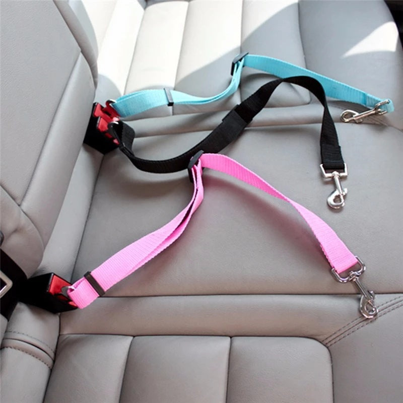 Adjustable PetVibe™ Universal Safety Seat Belt for cars, shown attached to a pet harness with secure clip and adjustable strap.