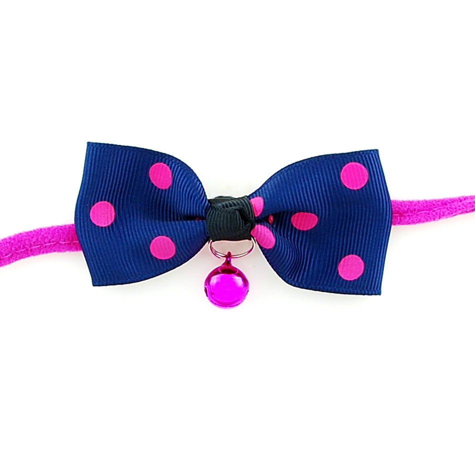 PetVibe™ polka-dot party bow collar on a pet, featuring a charming black and white polka-dot design and adjustable strap.