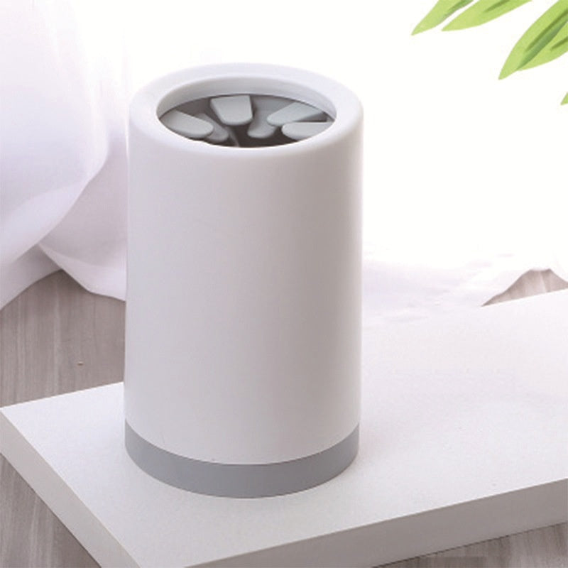 Portable Muddy Paw Cleaner with silicone bristles in a wash cup, designed for easy pet paw cleaning.